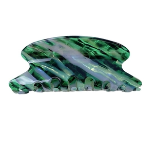 Elegant green marble acetate hair claw clip with a minimalist curved design for women