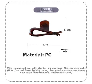 Detail view of a large amber texture shark hair claw clip with dimensions 12cm by 5.5cm