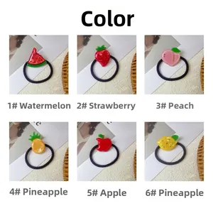 Detail view of colorful fruit acetate hair ties with sparkling rhinestone accents