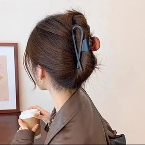 Minimalist large matte shark hair claw clip in navy blue for elegant French hairstyles