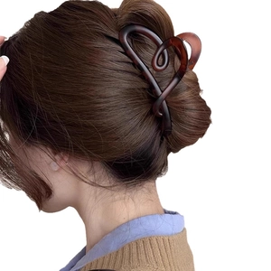 Elegant large amber heart hair claw clip for thick hair styling in a minimalist design