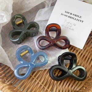 Elegant bow hair claw clips in dark green, tortoiseshell, light blue and matte black set