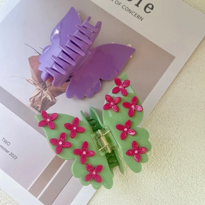 Elegant butterfly hair claw clips set in purple and green with floral rhinestones
