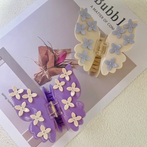Elegant butterfly hair claw clips with floral patterns and sparkling crystal accents