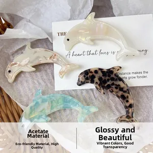 Lot de quatre barrettes dauphins en acétate de luxe aux motifs élégants et variés