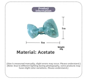 Blue marble acetate bow hair claw clip measuring 8cm length with product dimensions detail