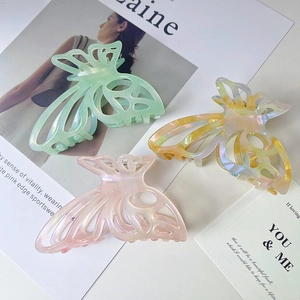 Elegant hollow butterfly acetate hair claws in iridescent pastel colors for women