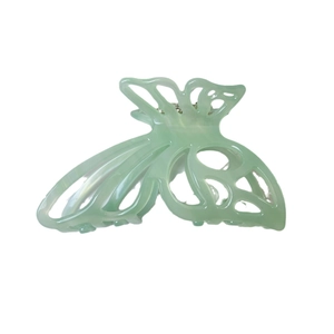 Elegant hollow butterfly acetate hair claw clip in mint green color on white background