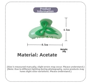 Pince à cheveux en acétate vert avec nœud, dimensions 8,5 cm de long et 4,5 cm de haut
