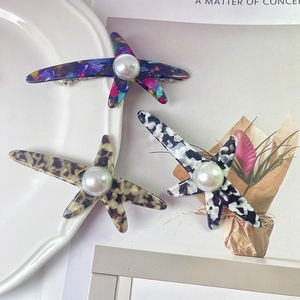 Lot de barrettes étoile de mer en acétate avec perles et motifs léopard et pied-de-poule