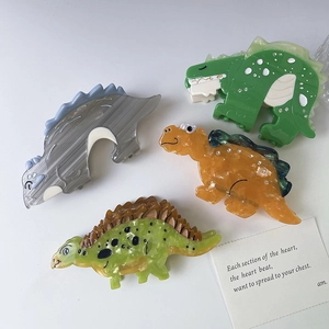 Lot de quatre pinces à cheveux dinosaure en acétate coloré avec strass brillants