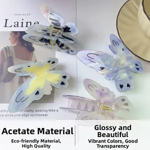 Detail of high-quality acetate butterfly hair claws with colorful macaron heart patterns