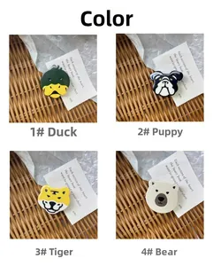 Detailed close-up of cute cartoon acetate animal hair clips in four different styles