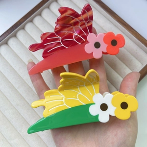 Chic acetate shark clips featuring colorful flower and butterfly designs for women