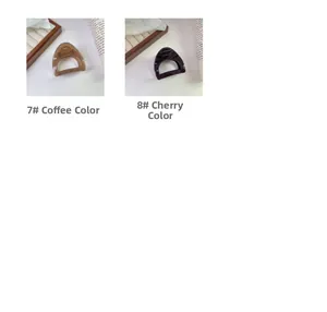Detail of coffee and cherry red triangular hair claws with a smooth resin finish