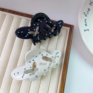 Elegant butterfly acetate hair claw clip with blue rhinestones in black and white styles