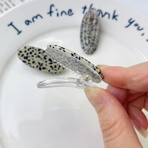Chic acetate duckbill hair clip with black and white spotted dalmatian pattern