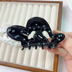 Elegant butterfly acetate hair claw clip with teal rhinestones for women's hair styling