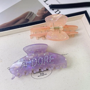 Summer rhinestone hair claw clips set in light purple and orange acetate finish
