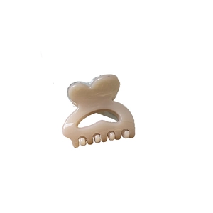 Cute heart-shaped mini hair claw clip in beige finish for elegant side hair styling