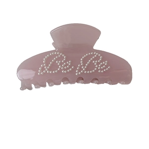 Pink translucent acetate hair claw clip with pearl Bebe lettering for women hair styling