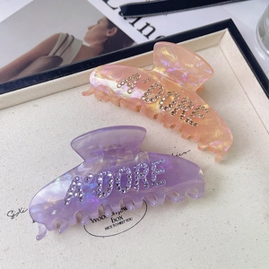 Elegant acetic acid shark hair claws with rhinestone letter A'DORE in orange and purple