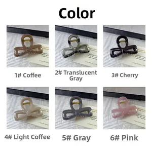 Close-up of 6 acrylic bow hair claws in coffee, grey, red, beige and pink tones