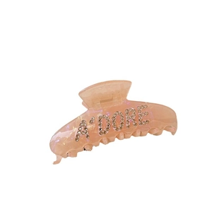 Pink marble acetate shark hair claw clip with A'DORE rhinestone lettering for women