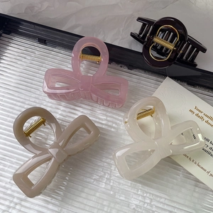 Minimalist thick acrylic bow hair claws in pink, beige and coffee colors for women