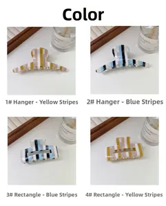 Détail des pinces à cheveux en acétate à rayures bleues et jaunes aux formes géométriques