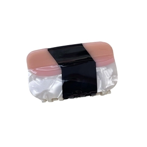 Elegant salmon sushi shaped acetate hair claw clip with pink and black color blocking