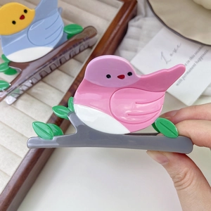 Bird on branch hair claw clips in acetate resin with colorful pastel bird design