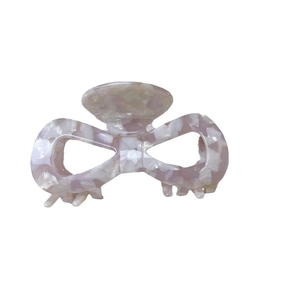 French vintage style marble pink bow claw clip for women made of premium acetate fiber