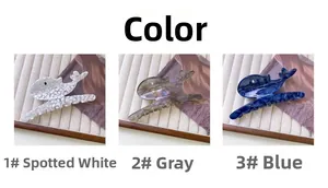 Detailed views of whale hair claws in marbled white, translucent grey, and navy blue acetate