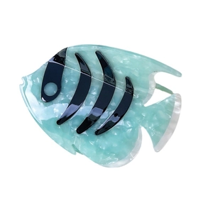 Fish shaped hair claw clip in mint green marble acetate with black stripes on white base