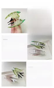 Macro detail of bird-shaped acetate hair claw clips with colorful patterns and metal spring