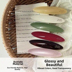 Set of six colorful vintage acetate oval hair clips with gold Barrette La France lettering