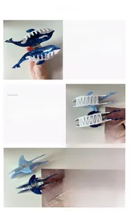 Detail view of acetate shark hair claw clips with blue and white marble textures