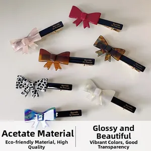 Detailed view of assorted acetate bow hair clips in various patterns and colors