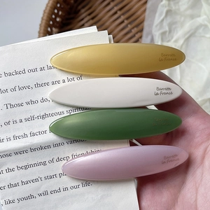 Set of four vintage acetate leaf oval hair clips in mustard, ivory, olive, and lilac tones