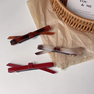 Barrettes à nœud en écaille, ambre et rouge avec base à ressort en métal argenté