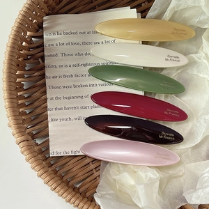 Set of 6 oval acetate hair clips in vintage colors with glossy finish and French lettering