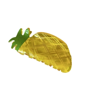 Unique pineapple hair claw clip in translucent yellow acrylic with green leaf design