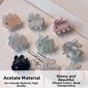 Detailed macro view of assorted mini acetate rabbit hair claws with sparkling rhinestones