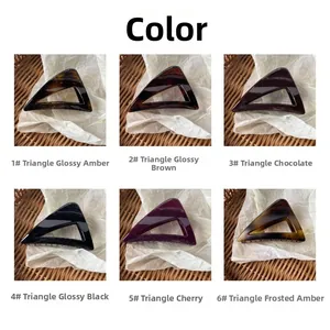 Detailed view of triangle hair claws in six colors including amber, black and cherry