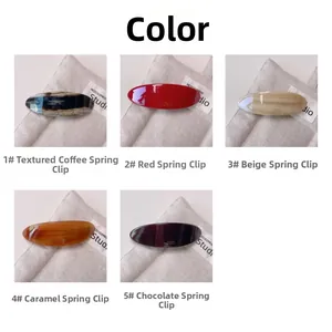 Detailed grid view of assorted acetate spring hair clips in various marble and solid colors