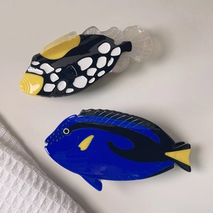 Creative ocean fish hair claws featuring vivid clown triggerfish and blue tang designs
