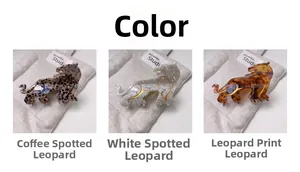 Detailed comparison of leopard-shaped acetate hair claws in three distinct color patterns