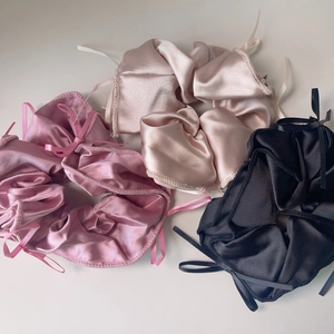 Three-piece satin bow hair scrunchie set in pink, champagne, and black colors