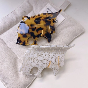 Pinces à cheveux léopard abstraites en acétate avec motifs écaille et fleurs